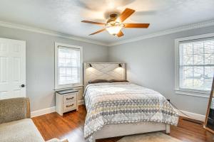 a bedroom with a bed and a ceiling fan at Waterfront Home with Dock and Yard in Hampton! in Hampton +25 photos