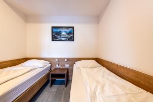 Łóżko lub łóżka w pokoju w obiekcie Wels Inn Hotel