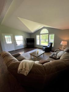 a living room with a couch and a table at Rosie's Surf Shack in Aberdeen