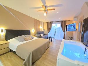 Кровать или кровати в номере Appart Hotel Spa Perpignan