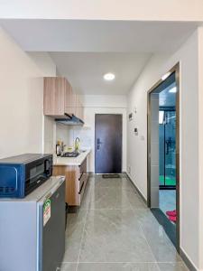 a kitchen with a refrigerator and a counter top at Iconic 1Br in Riverside with views and gym in Nairobi