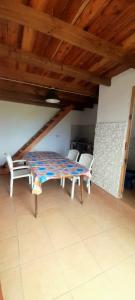 a dining room with a table and chairs in a room at Departamentos Lovaiza`s in Barrio Félix U Camet