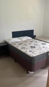 a large bed in a room with a mattress at Luciene in Xangri-lá