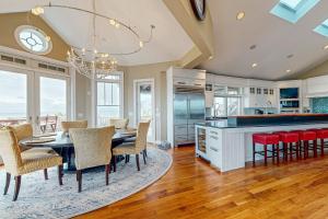 a kitchen and dining room with a table and chairs at The Chancellery --- 6 Hall Ave in Dewey Beach