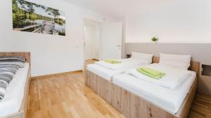 Łóżko lub łóżka w pokoju w obiekcie Moderne Ferienwohnung mit Bergblick