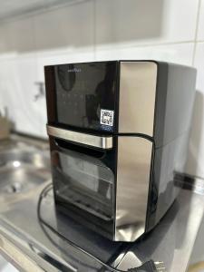 Η κουζίνα ή μικρή κουζίνα στο Aconchego Loft +13 φωτογραφίες