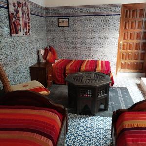 Postel nebo postele na pokoji v ubytování Ryad Bab Berdaine