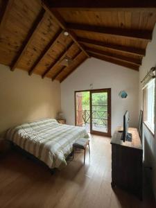 Postel nebo postele na pokoji v ubytování Casa Bere + 5 fotografií