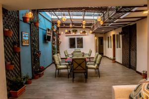 a dining room with a table and chairs at Casa 080 in Guatemala