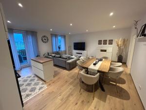 a living room with a table and a couch at Ferienwohnung Schöne Aussicht in Löf