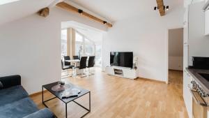 Telewizja i/lub zestaw kina domowego w obiekcie Moderne Ferienwohnung mit Bergblick