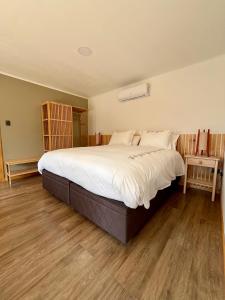 เตียงในห้องที่ El Arrayan