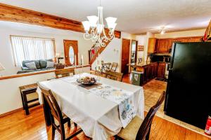 a kitchen and dining room with a table and chairs at The CubHouse Poconos getaway in Tobyhanna