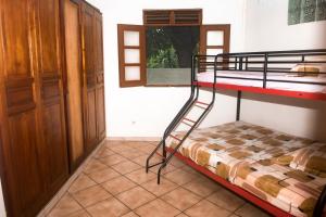 Rúm í herbergi á F3 au calme vue sur mer 2 chambres Balcon Terrasse