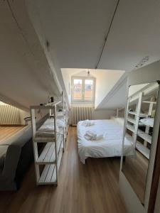 a room with two bunk beds and a bed at Pola's House Turin in Turin