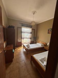 Postel nebo postele na pokoji v ubytování EVA APARTMENT