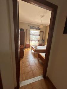 Postel nebo postele na pokoji v ubytování EVA APARTMENT