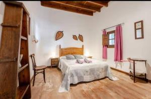 Postel nebo postele na pokoji v ubytování Alojamiento El Cortijuelo + 37 fotografií