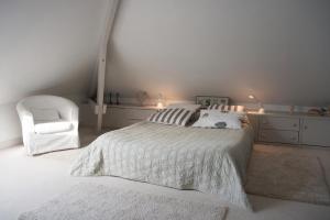 En eller flere senge i et værelse på Villa Flore Chambres d'Hotes