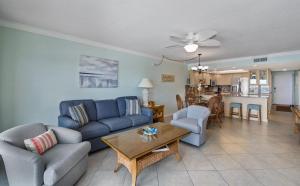 a living room with a couch and a table at Pelican Watch #503 by Sun Palace Vacations in Fort Myers Beach