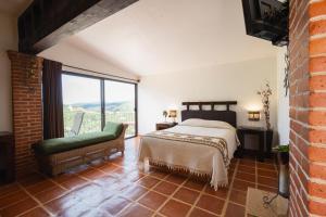 Postel nebo postele na pokoji v ubytování El Cantar del Viento- Hotel Boutique