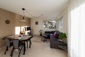 a living room with a couch and a table at Ferien im Paradies - Wohnung Vera in Höchst