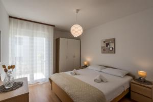 Postel nebo postele na pokoji v ubytování Apartment Orco