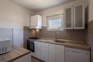Kuchyň nebo kuchyňský kout v ubytování Apartment Orco