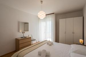 Postel nebo postele na pokoji v ubytování Apartment Orco
