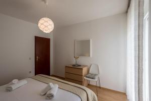 Postel nebo postele na pokoji v ubytování Apartment Orco
