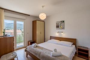 Postel nebo postele na pokoji v ubytování Apartment Orco