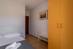 Postel nebo postele na pokoji v ubytování Apartment Orco