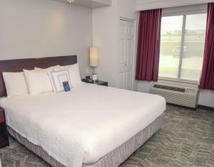 Ένα ή περισσότερα κρεβάτια σε δωμάτιο στο SpringHill Suites Houston Pearland