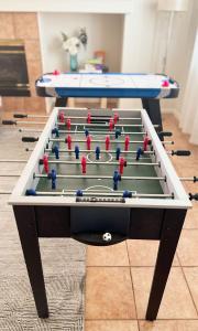 a pool table with balls on top of it at Relaxing Vegas Stay with BBQ & Games in Las Vegas