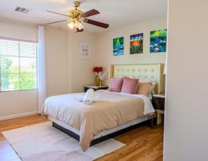 a bedroom with a bed and a ceiling fan at Relaxing Vegas Stay with BBQ & Games in Las Vegas
