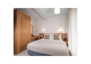 Tempat tidur dalam kamar di Plaza Hotel