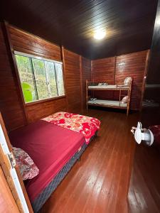 Giường trong phòng chung tại Sítio Cantinho da Felicidade