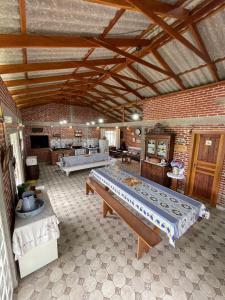 a large room with two large beds in it at Casa de campo com piscina em meio à natureza in Campo Magro +12 photos