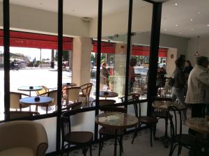 a group of tables and chairs in a restaurant at Hotel La Regence in Villefranche-sur-Mer