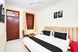 Voodi või voodid majutusasutuse Hotel O YATRA INN toas