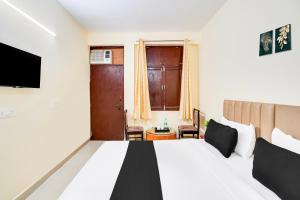 Voodi või voodid majutusasutuse Hotel O YATRA INN toas