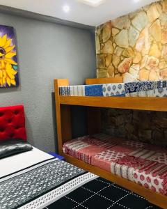 Postel nebo postele na pokoji v ubytování Pousada Apart Fraga Maia