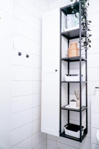 a bathroom with a black and white shelf at Boho Chic Home in Town Center in Viersen +109 photos