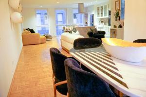 a living room with a table with chairs and a couch at Boho Chic Home in Town Center in Viersen