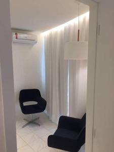 Uma área de estar em Flat Jaqueira Experience