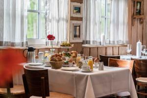 a dining room with a table with food on it at Seelodge Kremmen in Kremmen +63 photos