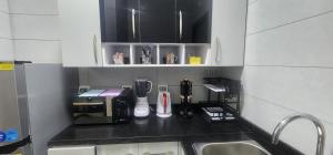 a kitchen with a counter top with a coffee maker at Madinaty apartment 4 شقة فندقية مفروشة سوبر لوكس في مدينتي in Madinaty