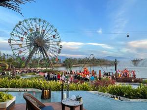 a ferris wheel at an amusement park with a crowd of people at 2 Bedroom Luxury Condo in Nuevo Vallarta 