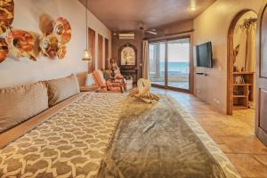 a living room with a view of the ocean at Villa Catalina at Bella Sirena - Private Jacuzzi - On the water in Puerto Peñasco +59 photos