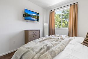 Postel nebo postele na pokoji v ubytování Gardenia at Evergreen
